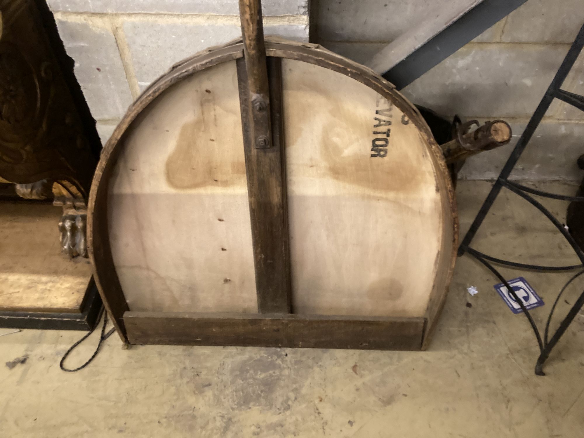 A Victorian mulch shovel, wrought iron pot stand and a yoke